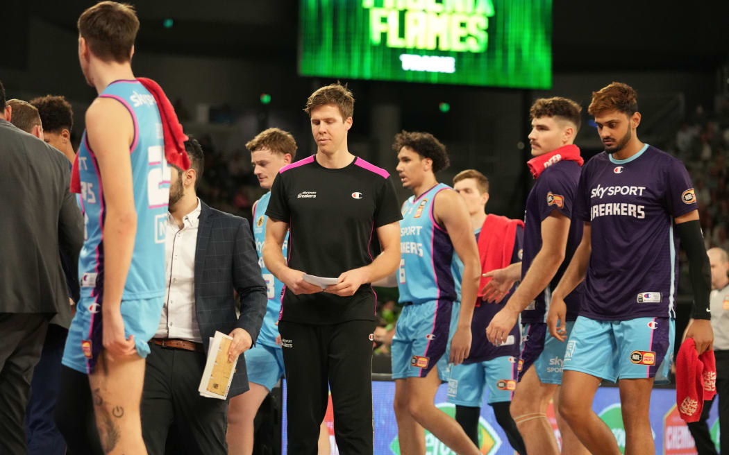 Tom Abercrombie of the New Zealand Breakers looks on from the bench.