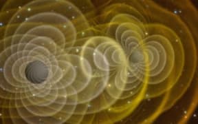 3D visualization of gravitational waves produced by two orbiting black holes.