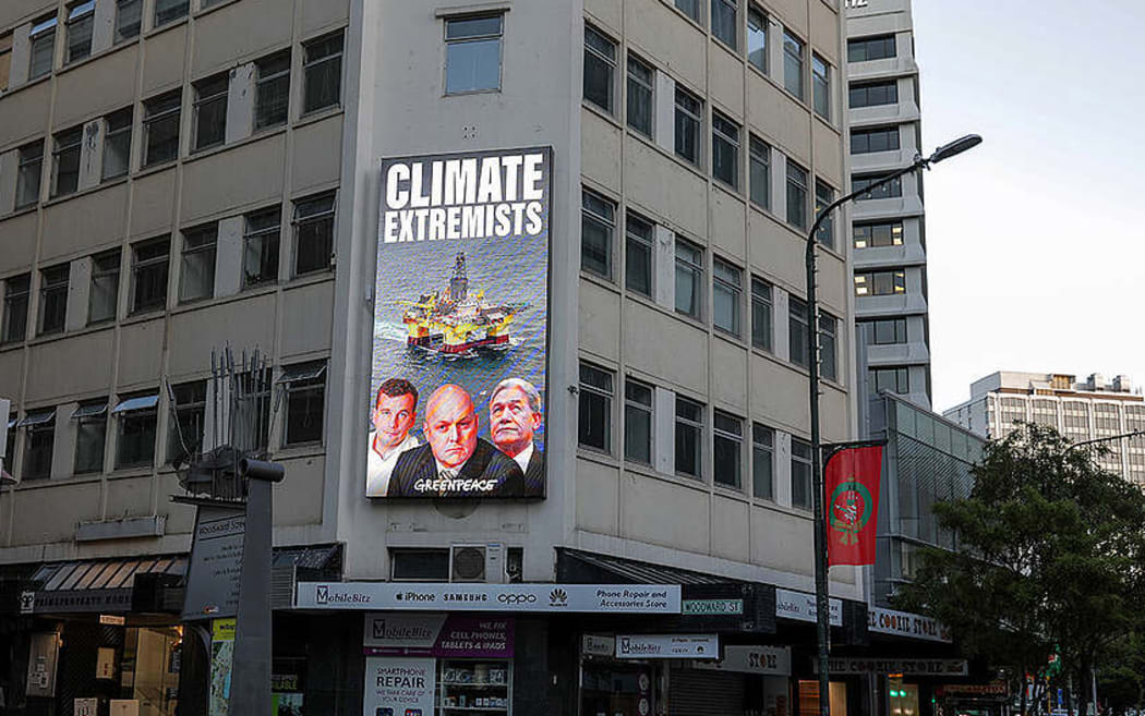 A Greenpeace billboard on climate extremists at Parliament.