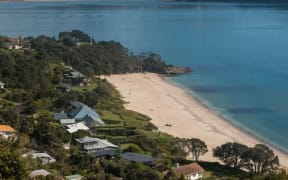 Houses and beach at Maramaratotara Bay, Coromandel.