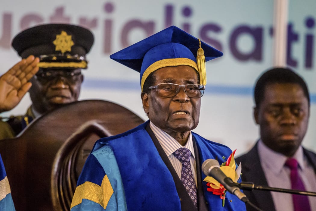 Zimbabwe's President Robert Mugabe delivers a speech during a graduation ceremony at the Zimbabwe Open University in Harare, where he presides as the Chancellor on November 17 2017.