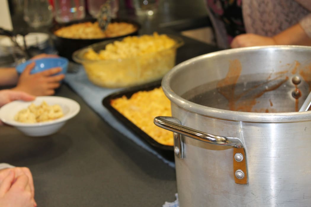 A photo of the pots of food on offer at the school hall. The "refugees" could pay a donation for a hot meal prepared by volunteers.