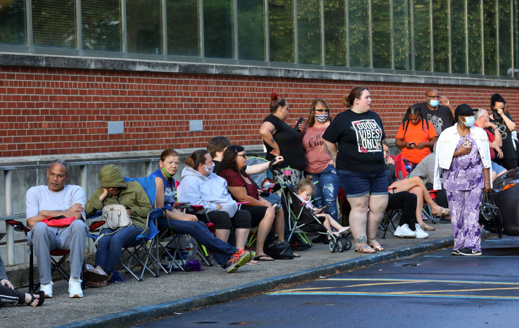 FRANKFORT, KY - JUNE 19: Hundreds of unemployed Kentucky residents wait in long lines outside the Kentucky Career Center for help with their unemployment claims on June 19, 2020 in Frankfort, Kentucky.