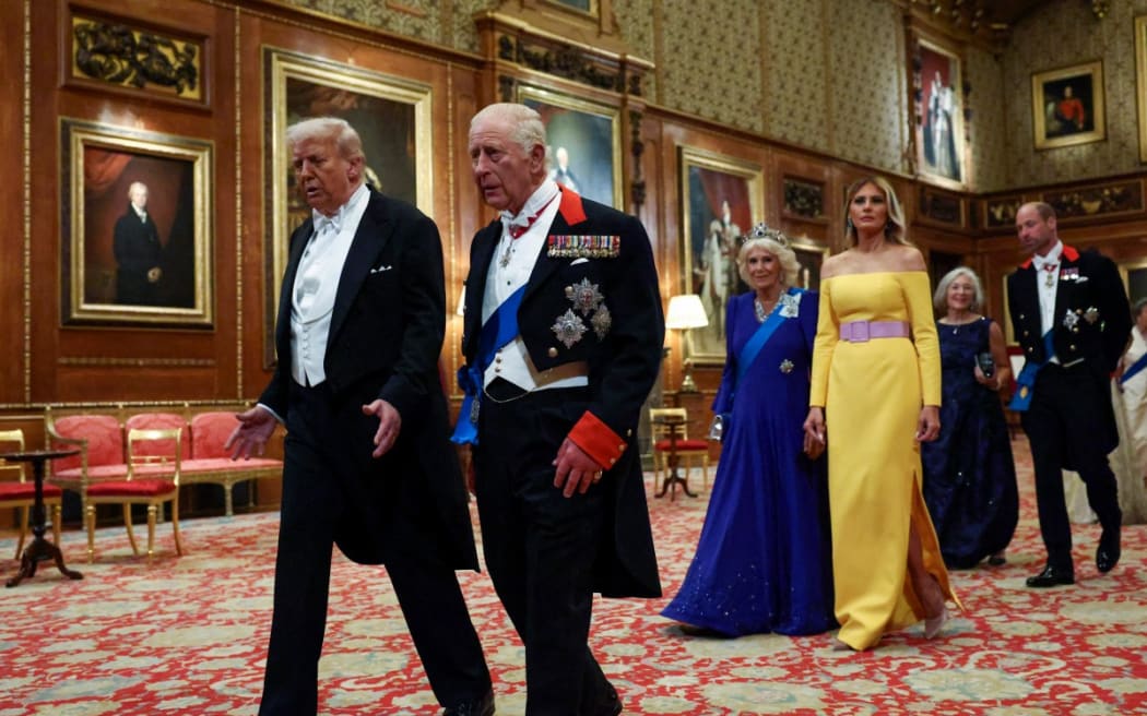 US President Donald Trump, left, and Britain's King Charles III arrive to attend a State Banquet at Windsor Castle, in Windsor, on September 17, 2025, during the US President's second State Visit.
