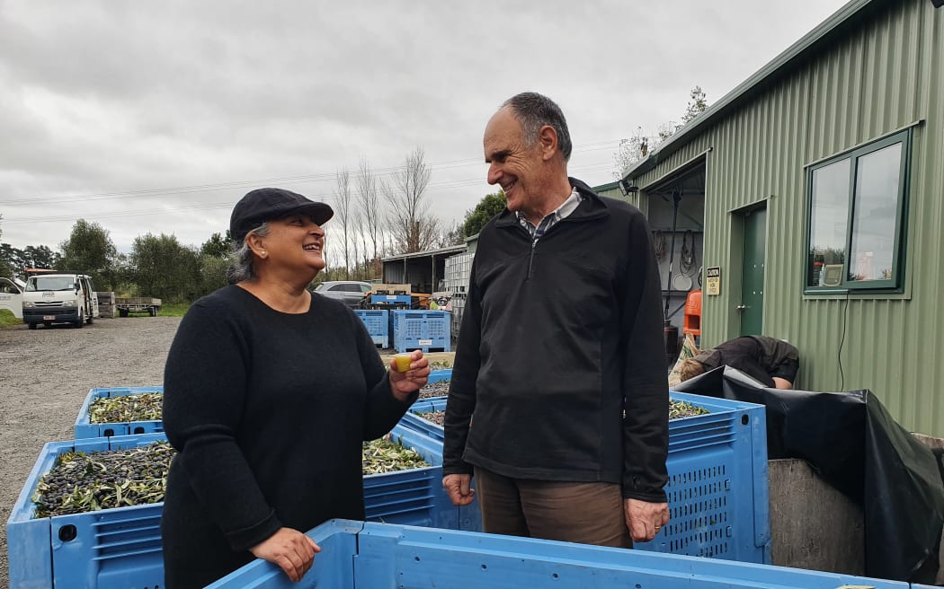 Nalini and Colin Baruch at Leafy Ridge olive mill tasting a drop of their 21st olive harvest