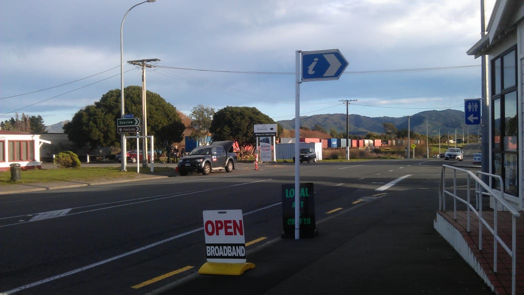 Seddon's main street with a train stopped in its tracks.
