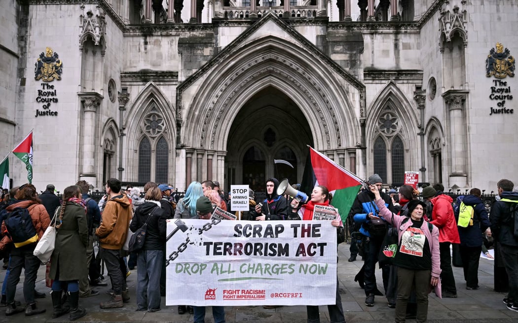 Pro-Palestinian activists celebrate Friday's ruling outside London's High Court.