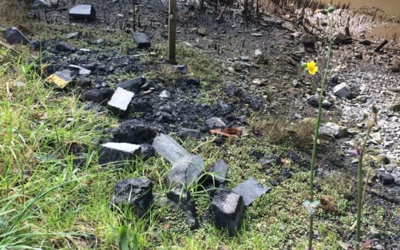 Road slabs thrown by a stream that feeds into Whangārei Harbour.
