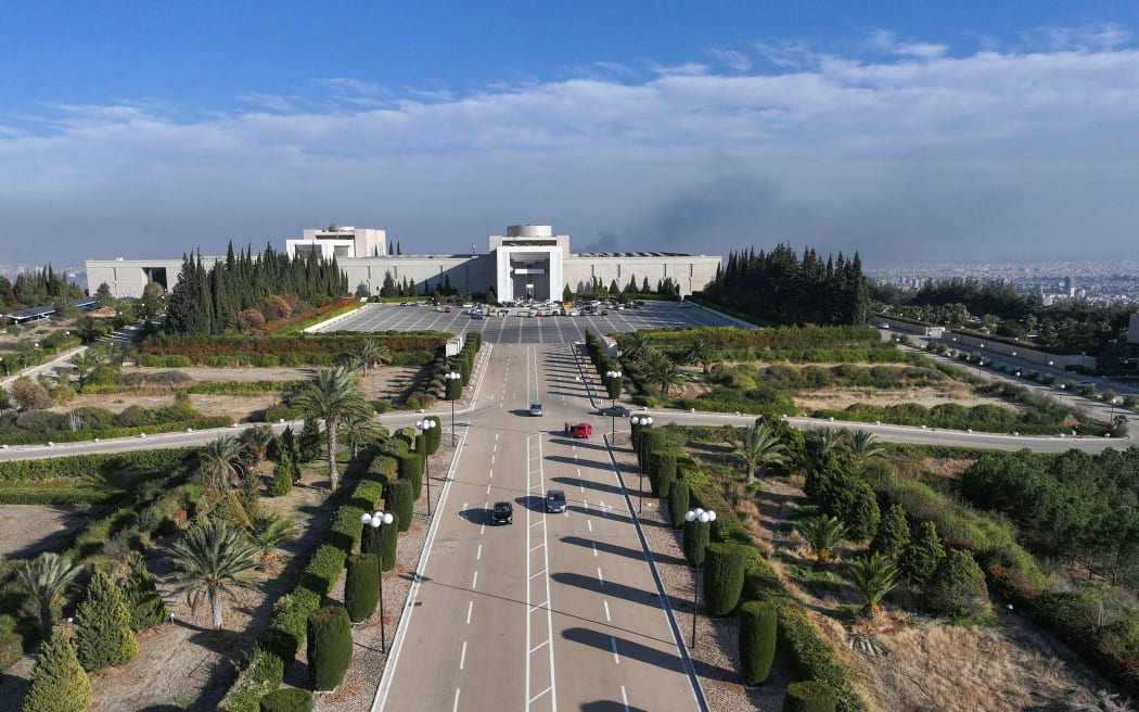 An aerial photo shows the Syrian presidential palace in Damascus' Mount Qasyoun on December 8, 2024, after Islamist-led rebels declared that they have taken the Syrian capital in a lightning offensive, sending President Bashar al-Assad fleeing and ending five decades of Baath rule in Syria. (Photo by Omar HAJ KADOUR / AFP)
