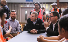 Prime Minister Chris Hipkins, centre, Emergency Management Minister Kieran McAnulty, left, and Finance Minister Grant Robertson at the Moana Nui A Kiwa Hub, for the south Auckland response to the flooding, in Māngere, 1 Febraury 2023.