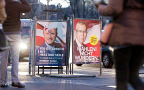 Two election placards of the presidential candidates Norbert Hofer (l - FPÖ) and Alexander Van der Bellen stand side-by-side on 03 December 2016 in Vienna, Austria.