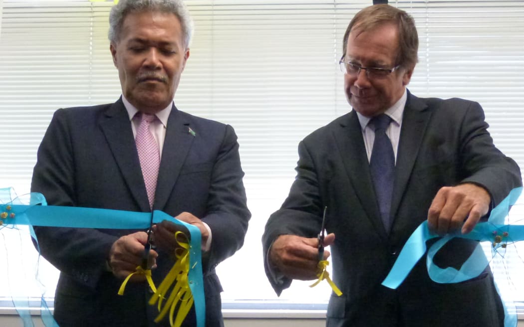 Tuvalu's Prime Minister, Enele Sopoaga, and New Zealand's Foreign Minister, Murray McCully, cut the ribbon to open Tuvalu's High Commission in Wellington
