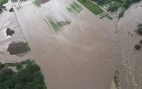 Flood in central New Caledonian plains affecting crops.