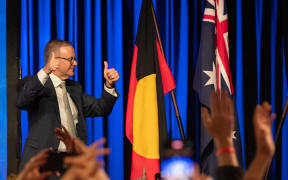 Australian Labor Party leader Anthony Albanese celebrates as he walks off the stage in Sydney on election night after winning the 2022 general election.
