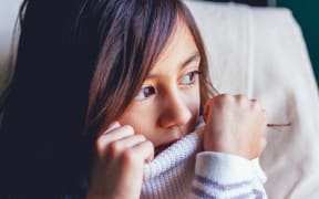 brown haired girl looking shy