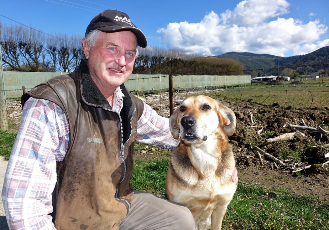 Riwaka fruit and vegetable grower Frank Hickmott with his dog Suzie.