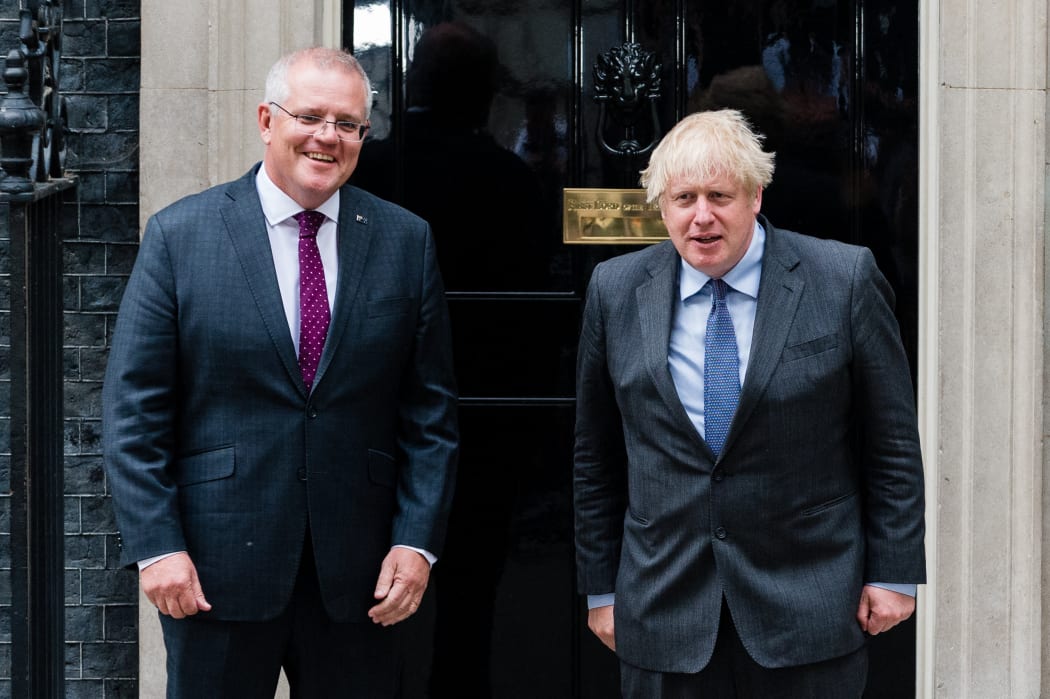 Australia's Prime Minister Scott Morrison, left, with Britain's Prime Minister Boris Johnson on the steps of 10 Downing Street in London, Britain, 14 June 2021.