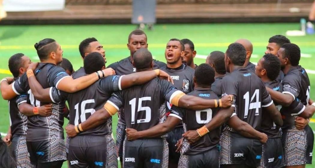 The Fiji Residents team huddle together.