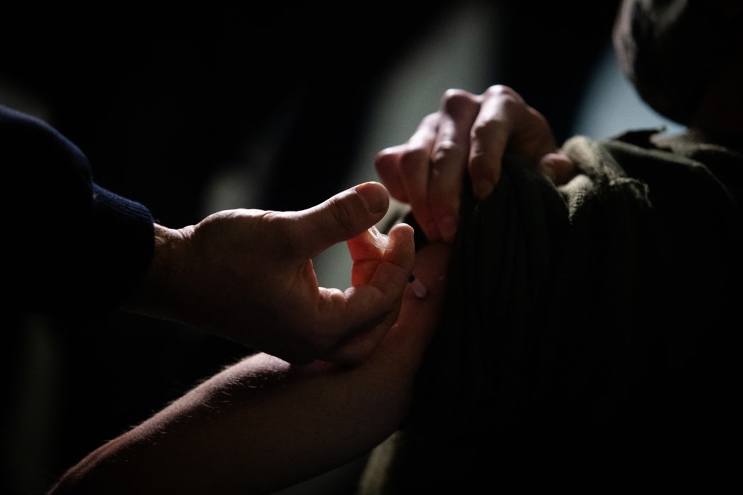 A Covid-19 vaccine supplied under the COVAX scheme is given to a member of the armed forces in Buenos Aires, Argentina, on 15 June.