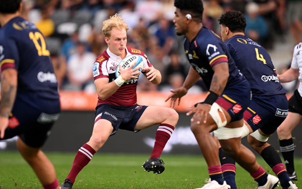DUNEDIN, NEW ZEALAND - MARCH 22: Tom Lynagh of the Reds 
charges forward during the round six Super Rugby Pacific match between Highlanders and Queensland Reds at Forsyth Barr Stadium, on March 22, 2025, in Dunedin, New Zealand. (Photo by Joe Allison/Getty Images)