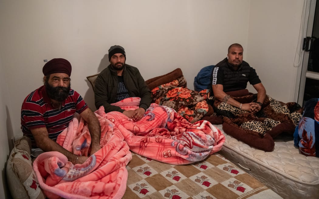 Workers are crammed into small rooms in an Auckland house.