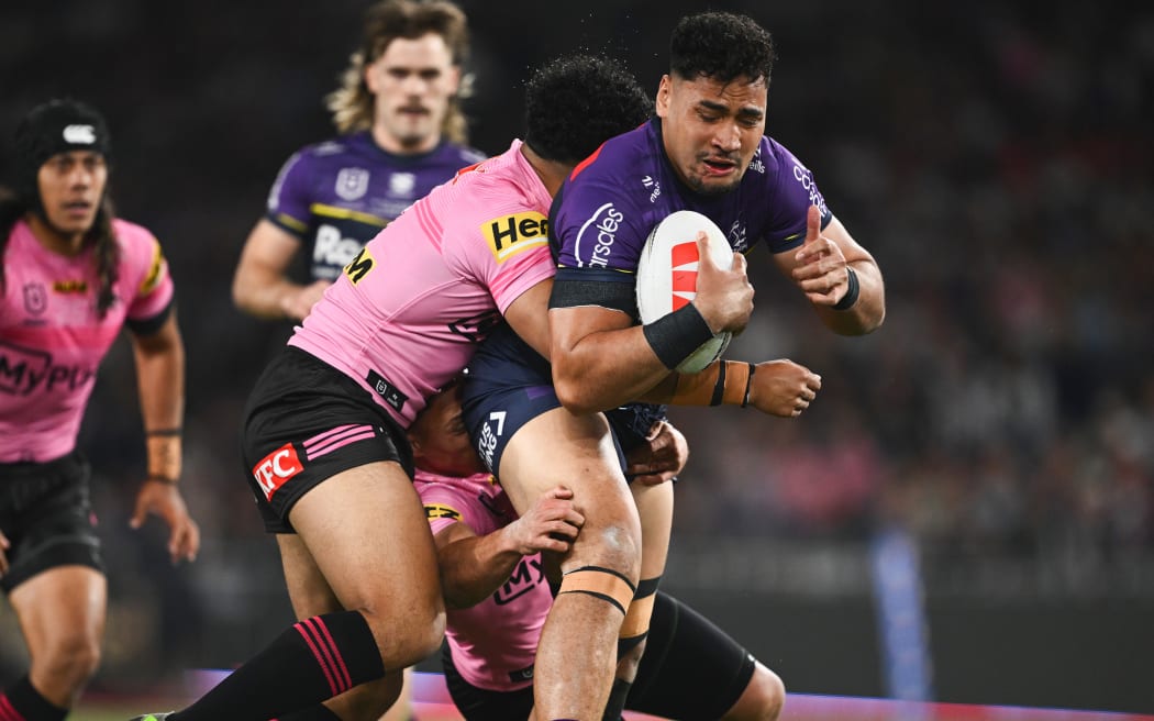 Eliesa Katoa of the Storm is tackled by Paul Alamoti of the Panthers during the NRL Grand Final match between the Melbourne Storm and the Penrith Panthers at Accor Stadium in Sydney, Sunday, October 06, 2024.  (AAP Image/Dan Himbrechts/Photosport)