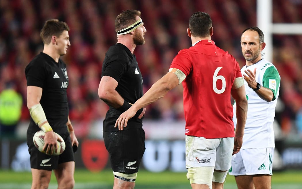 Kieran Read and Sam Warburton talk to referee Romain Poite during the 3rd test.