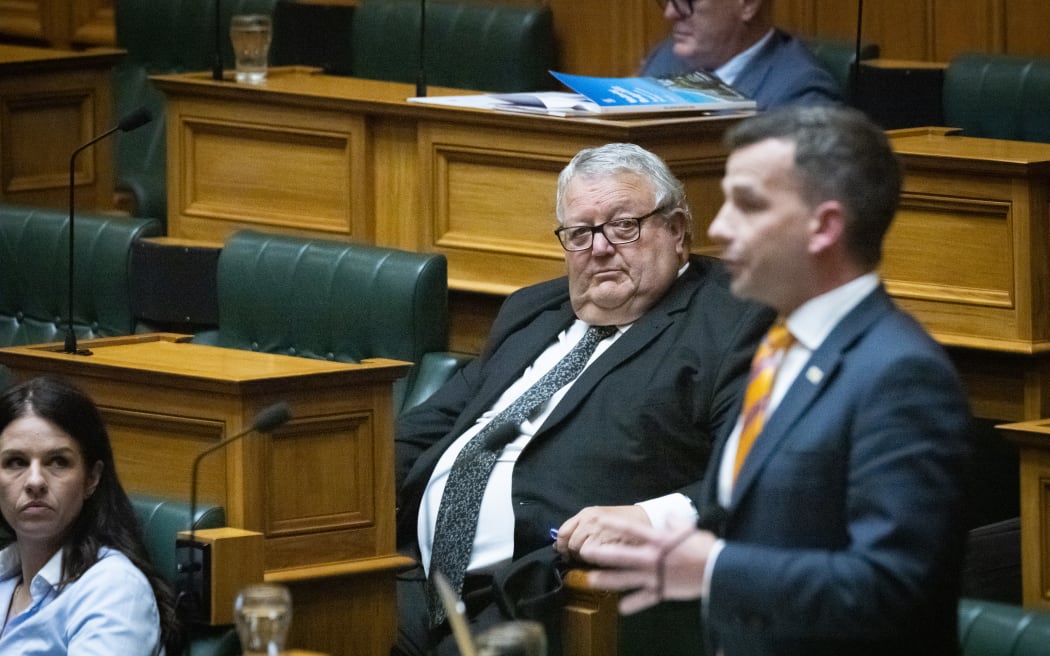 National Party MP Gerry Brownlee listens to David Seymour in the debating chamber