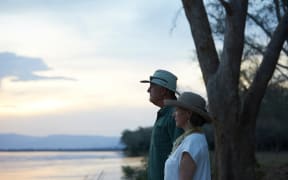 Tourists looking out to sea, Zambezi, Zambia (Photo by Michael Greenberg / Image Source / Image Source via AFP)