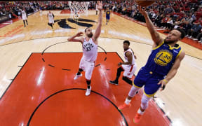 Stephen Curry #30 of the Golden State Warriors attempts a shot against Marc Gasol #33 of the Toronto Raptors during Game Two of the 2019 NBA Finals.