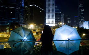 Pro-democracy demonstrators stood divided on Sunday over whether to withdraw from protest sites across Hong Kong.
