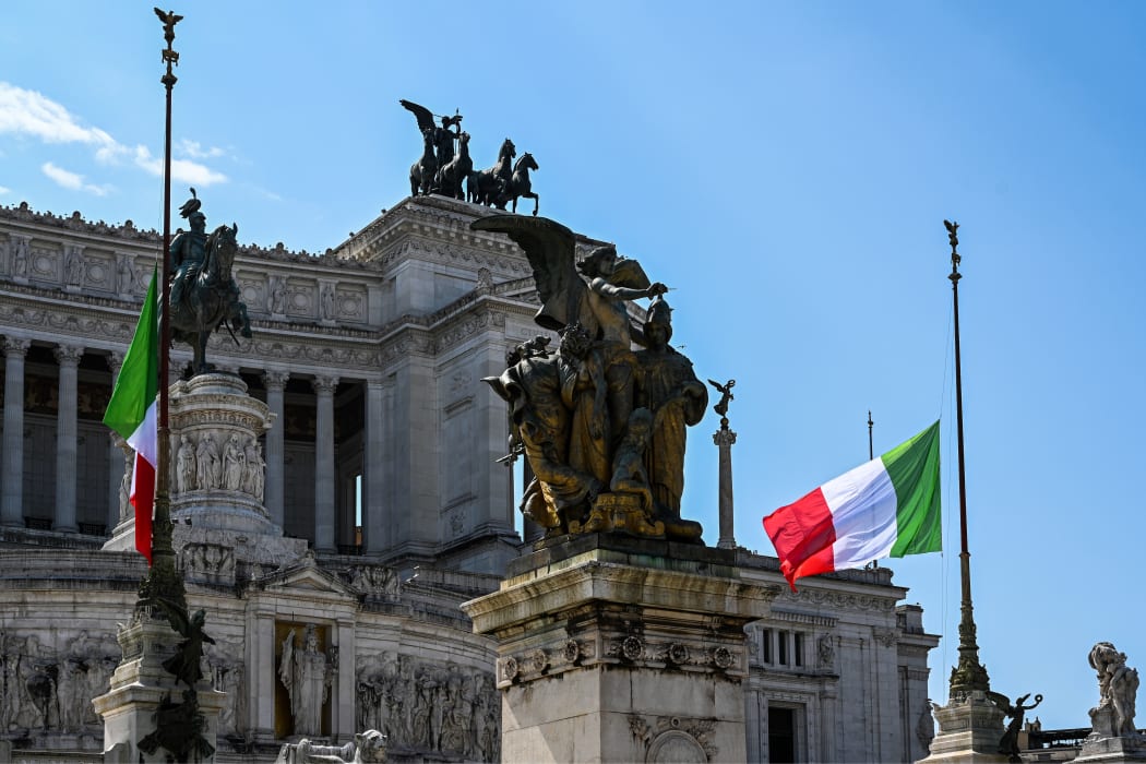 Italian flags at half-mast on the Vittorio Emanuele II monument in Rome. Flags are being flown at half-mast in cities across Italy to mark the victims of the pandemic.