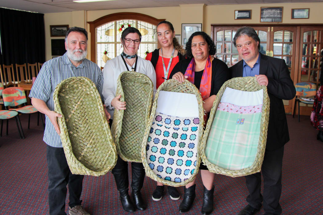 From left, Dr Ruakere Hond, Rachael Peek, Taranaki DHB associate director of Midwifery, Grace Maha, Taranaki DHB midwife and SUDI prevention coordinator, and Puhi and Philip Nuku, local weavers.