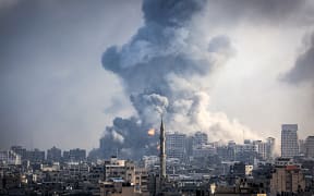 Smoke plumes billow during Israeli air strikes in Gaza City on October 12, 2023 as raging battles between Israel and the Hamas movement continue for the sixth consecutive day. Washington urged Israel to show restraint in its response to Hamas's surprise attack -- the worst in the country's 75-year history -- which Israeli forces said killed more than 1,200 people, mostly civilians. In Gaza, officials have reported more than 1,200 people killed in Israel's uninterrupted campaign of air and artillery strikes, while the UN said more than 338,000 people have been displaced. (Photo by IBRAHIM HAMS / AFP)