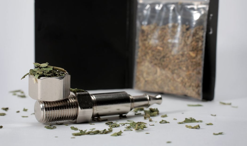 Synthetic cannabis and a pipe.