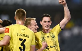 Wellington Phoenix celebrate the goal of Kosta Barbarouses during their Round 8 match against Macarthur FC.