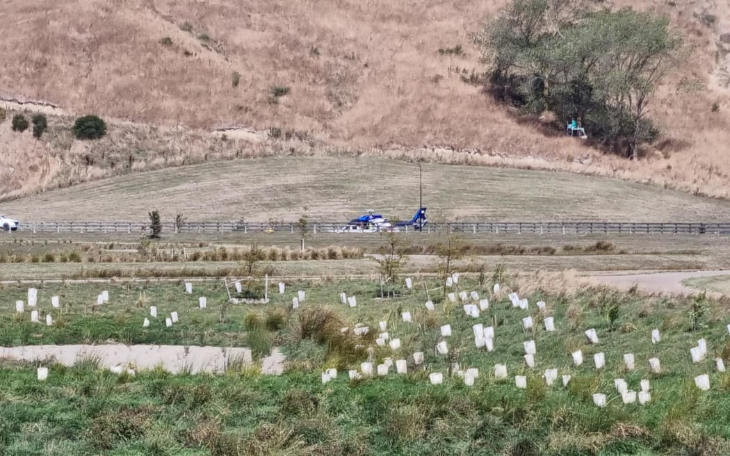 Helicopters are filling monsoon buckets at the Cashmere Wetlands off McVicars Road, loading up to fight the fire on the Port Hills on 14 February 2024.