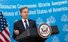 US Secretary of State Antony Blinken greets embassy staff at the US embassy in Kyiv on 19 January 2022 as part of a two-day visit in Ukraine.