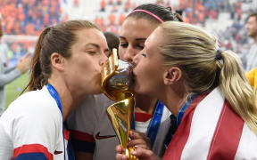 USA's players kiss the trophy after the France 2019 Womens World Cup football final match between USA and the Netherlands.