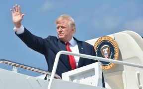 US President Donald Trump boards Air Donald Trump boards Air Force One to head of on summer vacation.