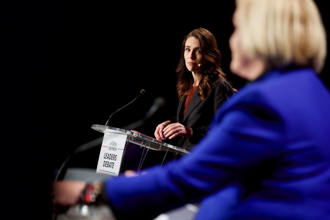 Labour leader Jacinda Ardern looks on as National leader Judith Collins speaks at The Press debate in Christchurch.  06/10/20