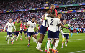 England players celebrate a penalty shootout win over Switzerland at Euro 2024.