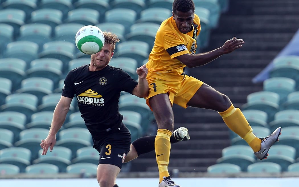 Team Wellington's Steven Gulley and Magenta's Noel Kaudre compete for the ball durnig the OFC semi-final.