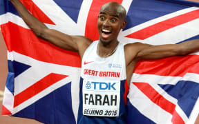 Mohamed Farah of Great Britain celebrates winning the 10000m, Beijing, 2015.