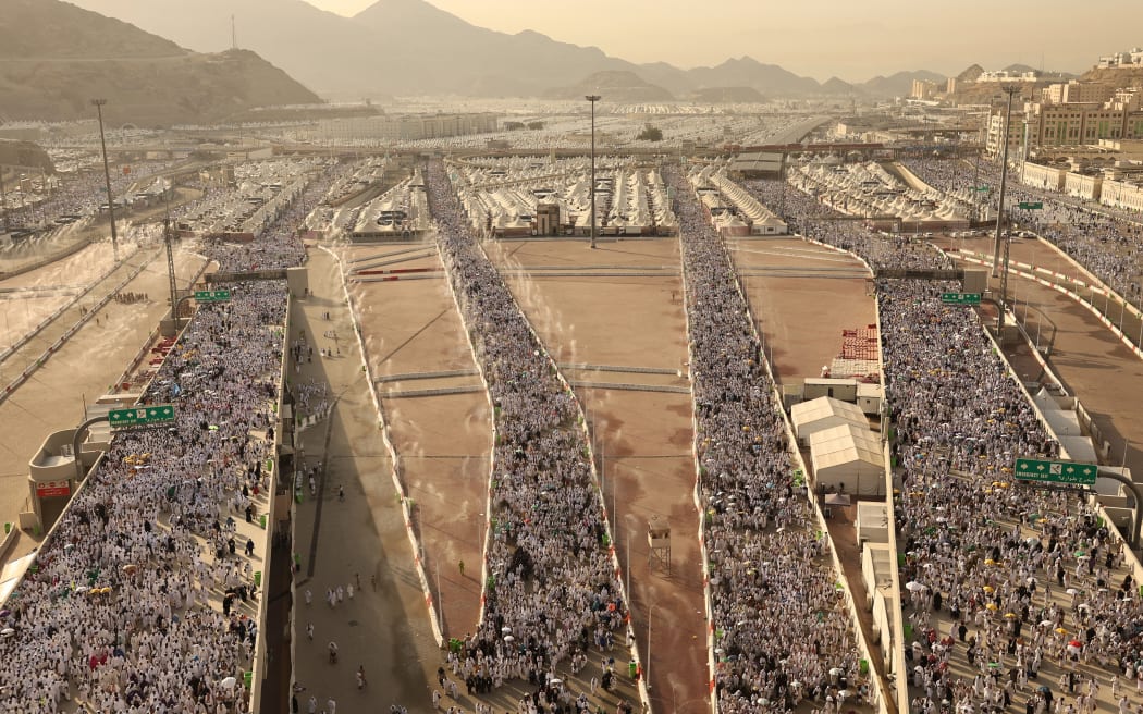 Muslim pilgrims arrive to perform the symbolic 'stoning of the devil' ritual as part of the hajj pilgrimage in Mina, near Saudi Arabia's holy city of Mecca, on June 16, 2024.