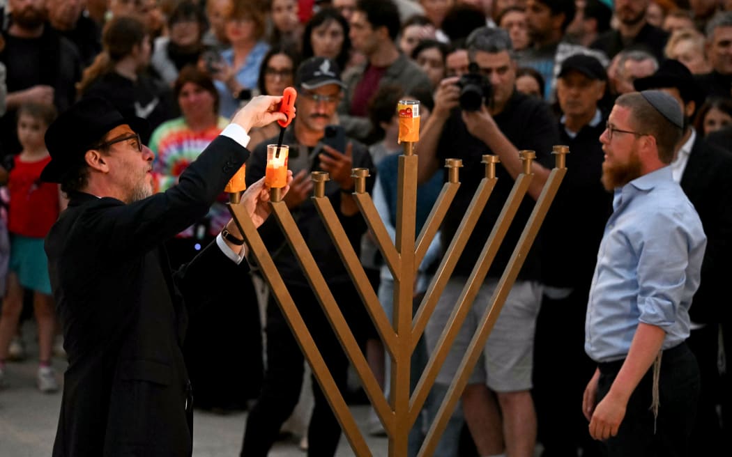 Mourners gather at a tribute at the Bondi Pavillion in memory of the victims of a shooting at Bondi Beach, in Sydney on 15 December, 2025.