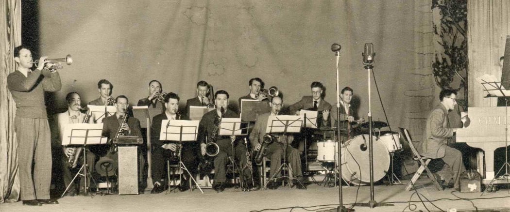 Doug Kelly's Radio Band playing at Christchurch's first Jazz Concert in 1951. Doug Kelly on the far left on trumpet. Gerald Marston is first on the left in back row. Doug Caldwell at the piano.