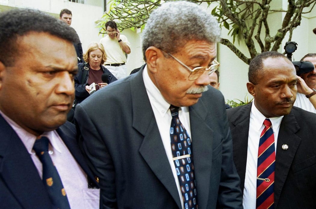 Laisenia Qarase, flanked by bodyguards, after he was appointed prime minister in 2000.