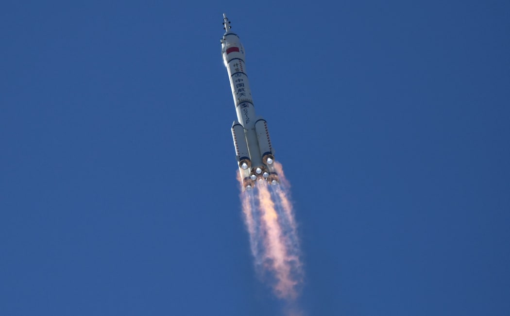 A Long March-2F carrier rocket, carrying the Shenzhou-12 spacecraft and a crew of three, heads to orbit after lifting off from the Jiuquan Satellite Launch Centre in the Gobi desert in northwest China on June 17, 2021,