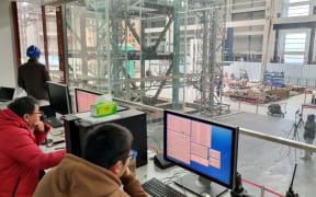 Researchers analyse the test results at the earthquake laboratory in Shanghai.
